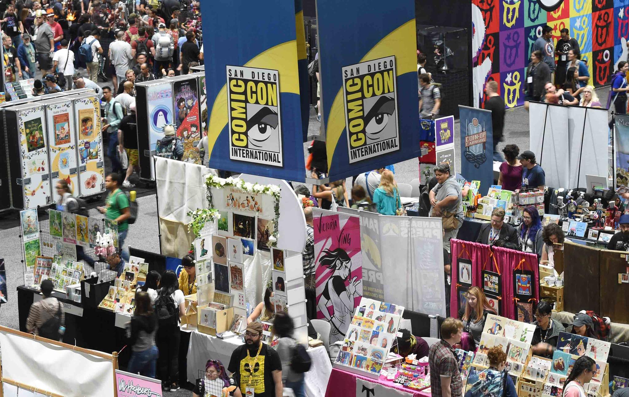 Comic-Con attendees walk the convention center floor during preview night at Comic-Con International on July 17, 2019, in San Diego, Calif.