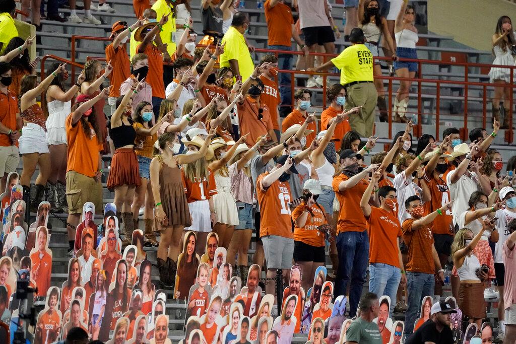 Fans join in singing "The Eyes of Texas" after Texas defeated UTEP 59-3 in an NCAA college football game in Austin