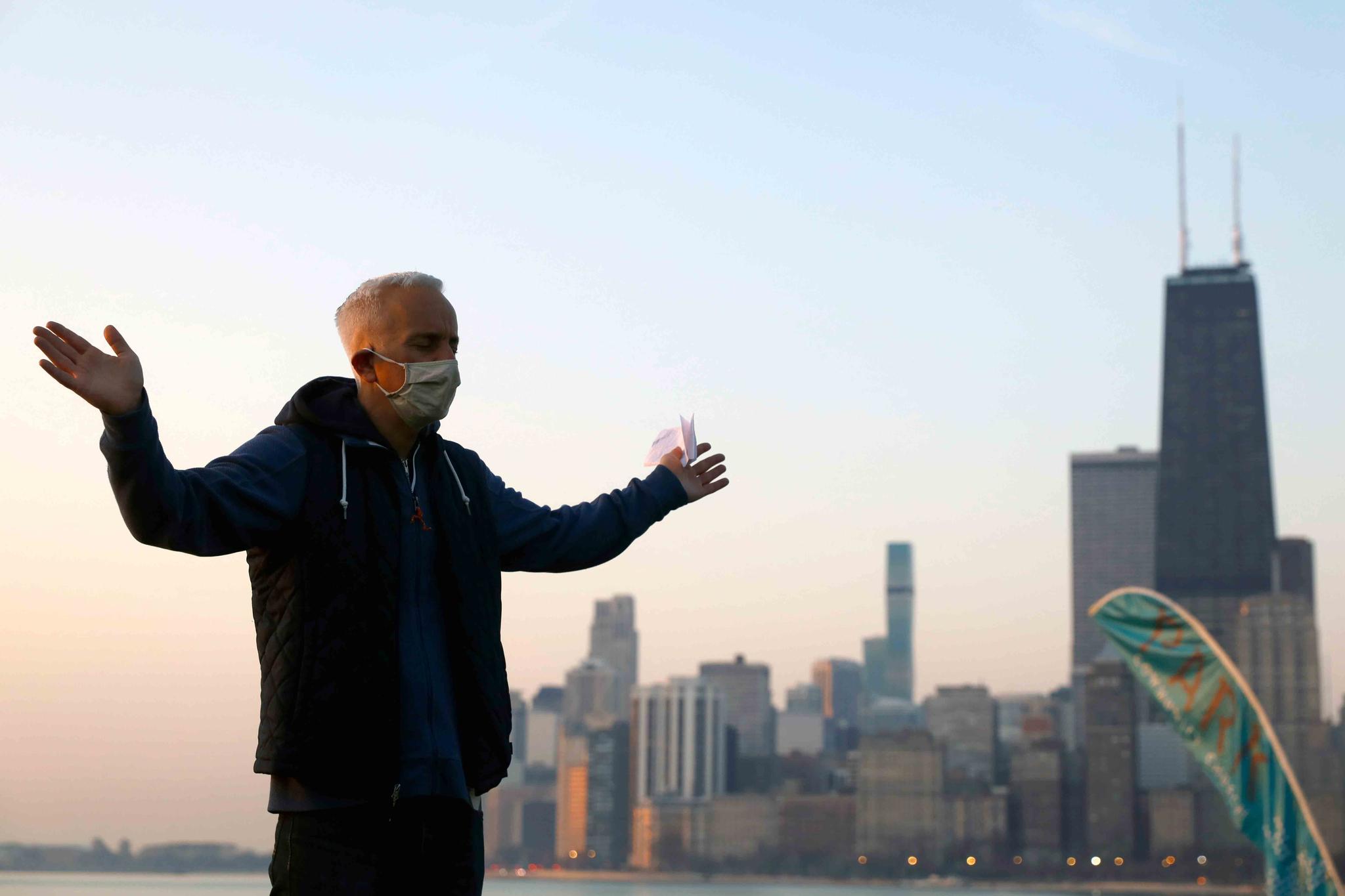Park Community Church Pastor Joe Riccardi raises his hands as he prays during an Easter sunrise service on Sunday, April 4, 2021,