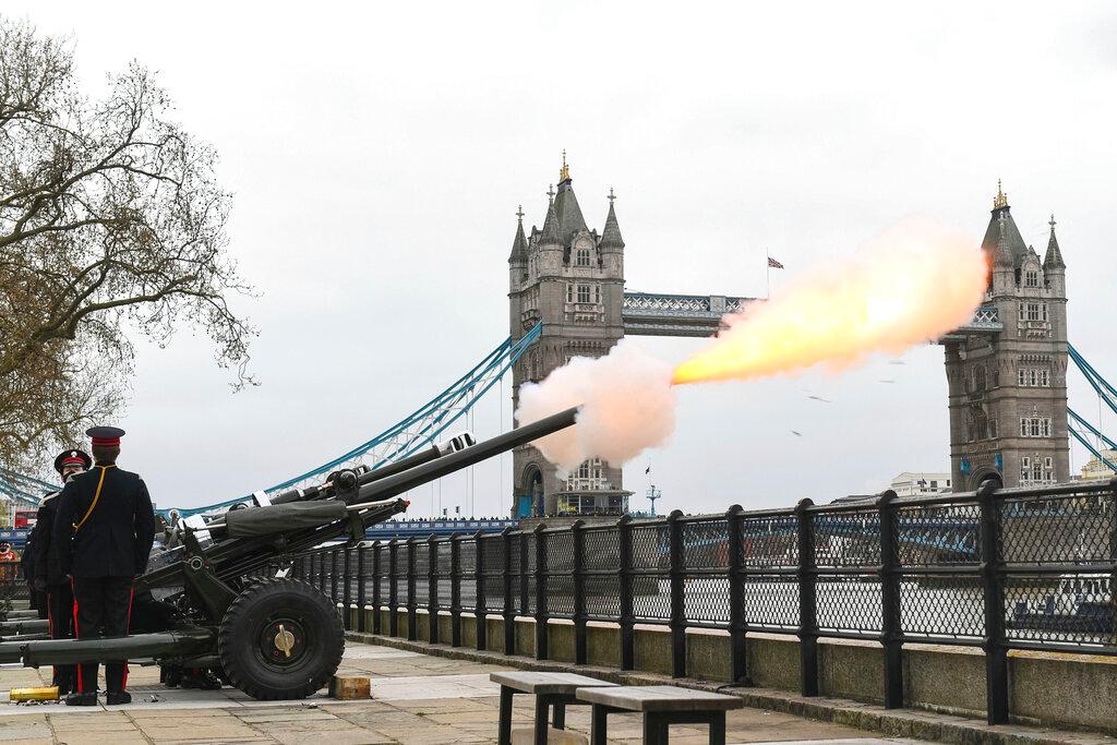 Members of the Honourable Artillery Company fire a 41-round gun salute from the wharf at the Tower of London, to mark the death of Prince Philip, in London, Saturday, April 10, 2021. Britain's Prince Philip, the irascible and tough-minded husband of Queen Elizabeth II who spent more than seven decades supporting his wife in a role that mostly defined his life, died on Friday.
