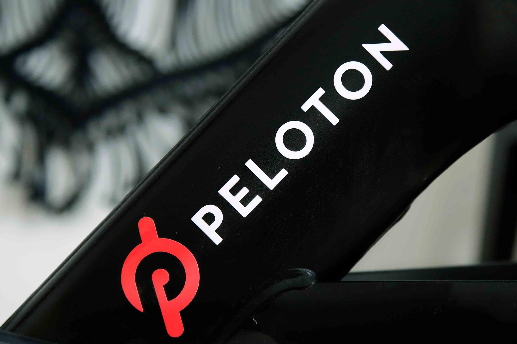 Peloton logo on the company's stationary bicycle in San Francisco. Safety regulators are warning people with kids and pets to immediately stop using a treadmill made by Peloton after one child died and nearly 40 others were injured. 