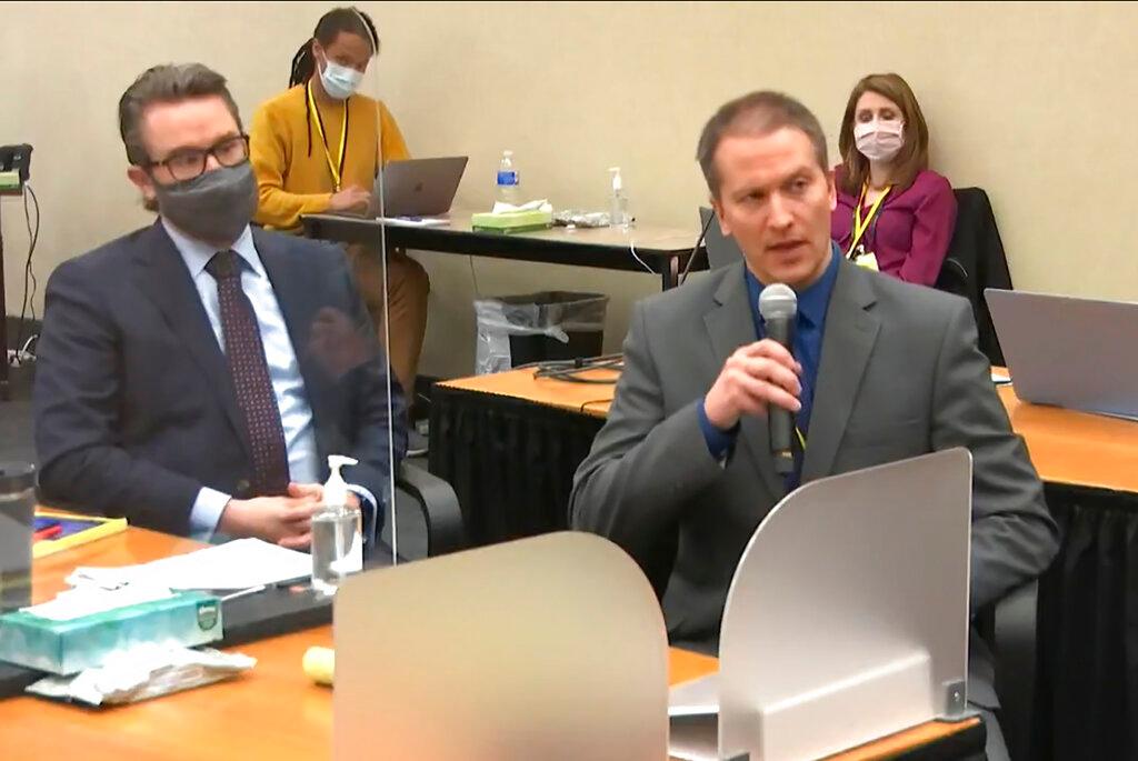 Defense attorney Eric Nelson, left, and former Minneapolis police Officer Derek Chauvin