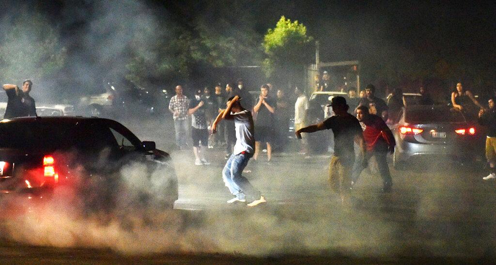 Street racers gather in the parking lot of the Goodwill on Northeast Marine Drive and 122nd Avenue in Portland, Ore. 