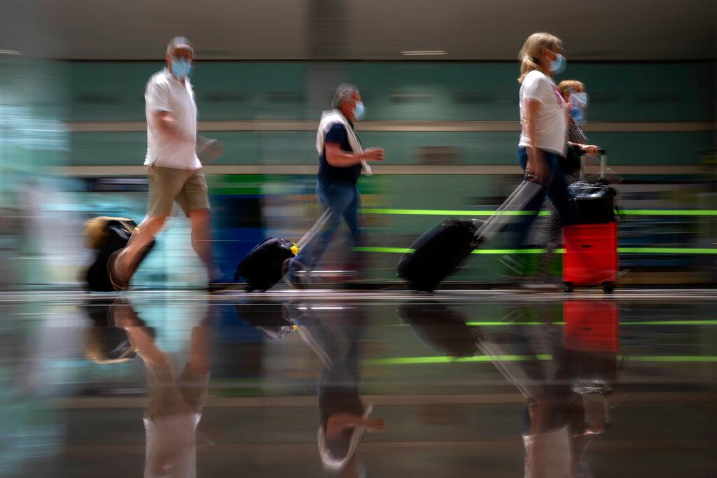 Tourists arrive at Barcelona airport, Spain