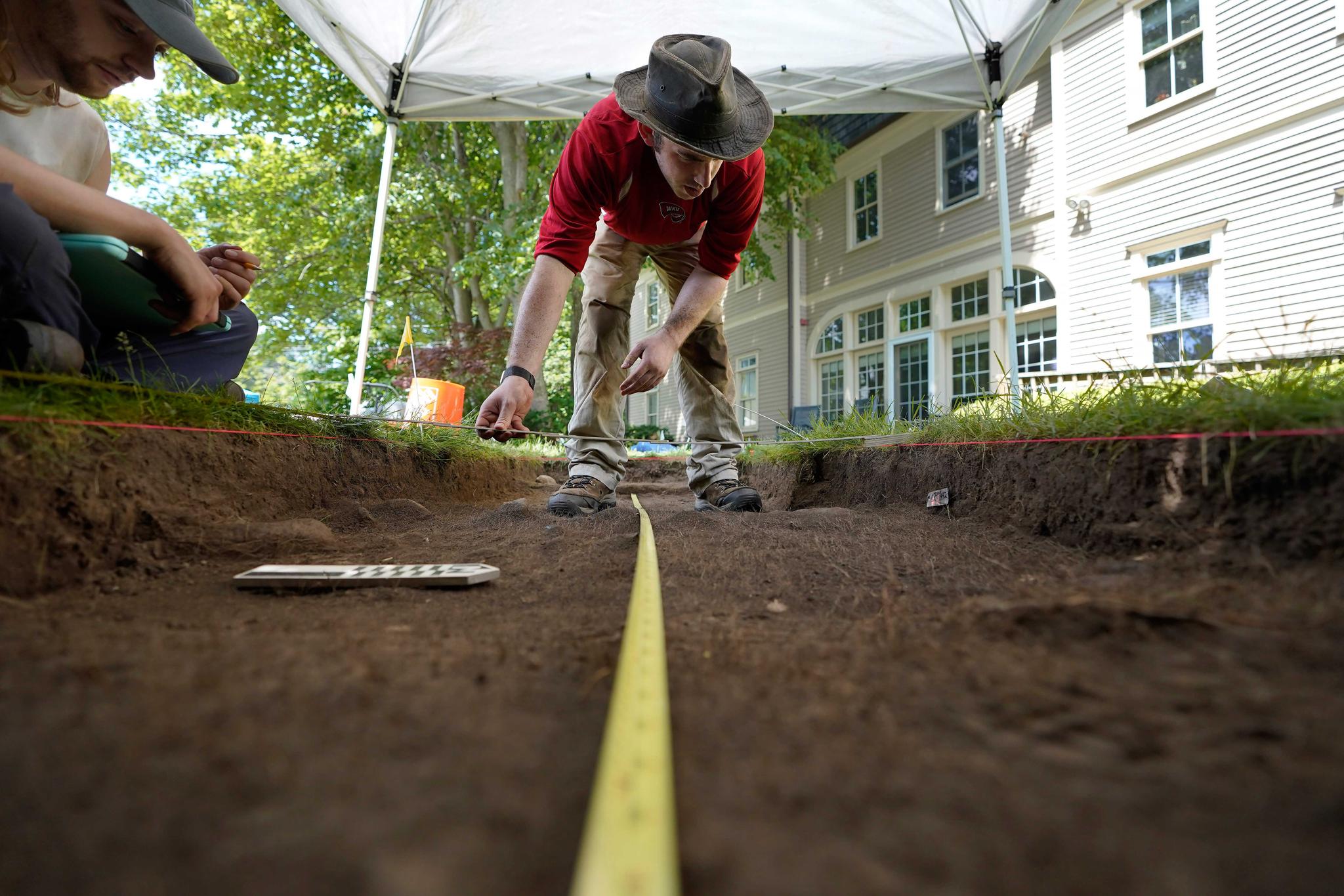 Archaeologists dig hilltop over Plymouth Rock