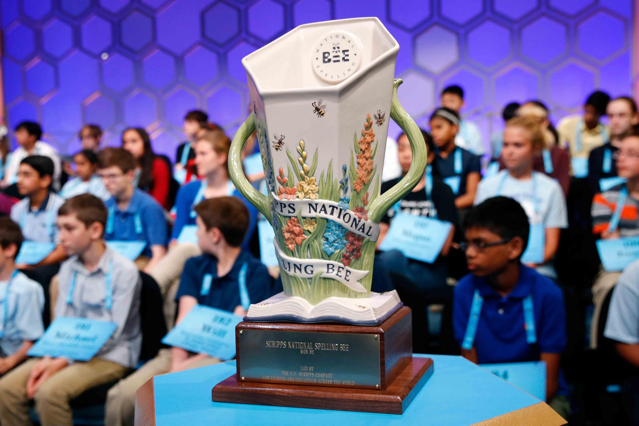 Scripps National Spelling Bee trophy sits in front of competitors in Oxon Hill, Md.