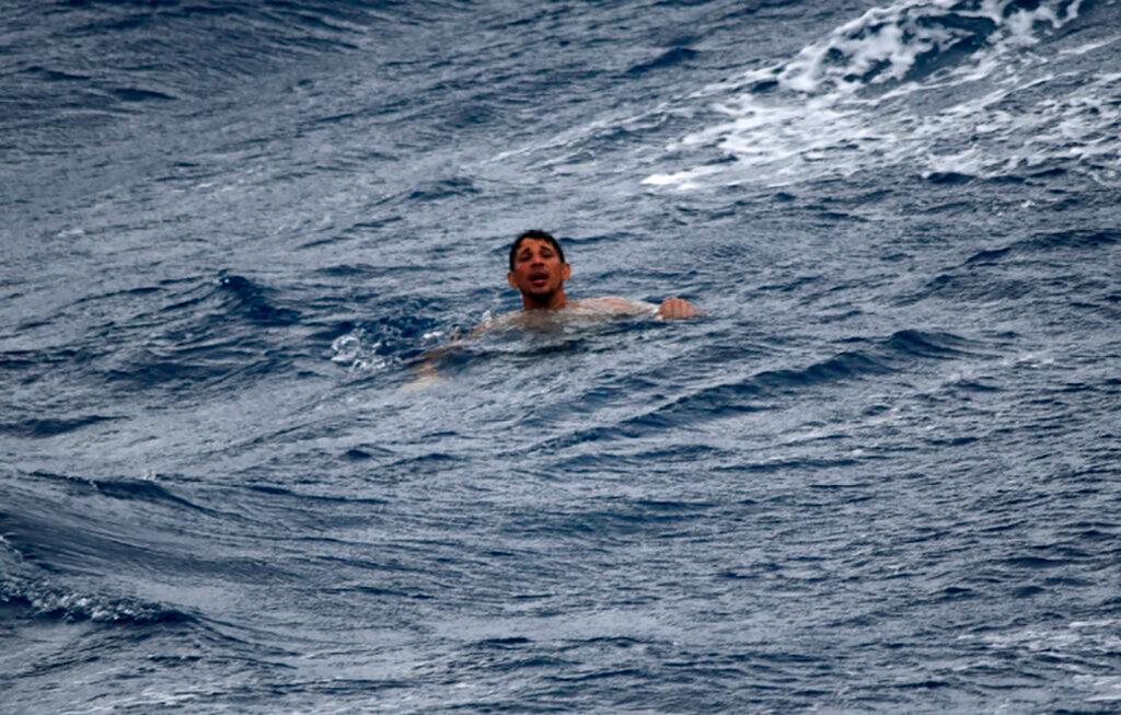 A man treads water and awaits rescue crews approximately 32 miles southeast of Key West, Fla.