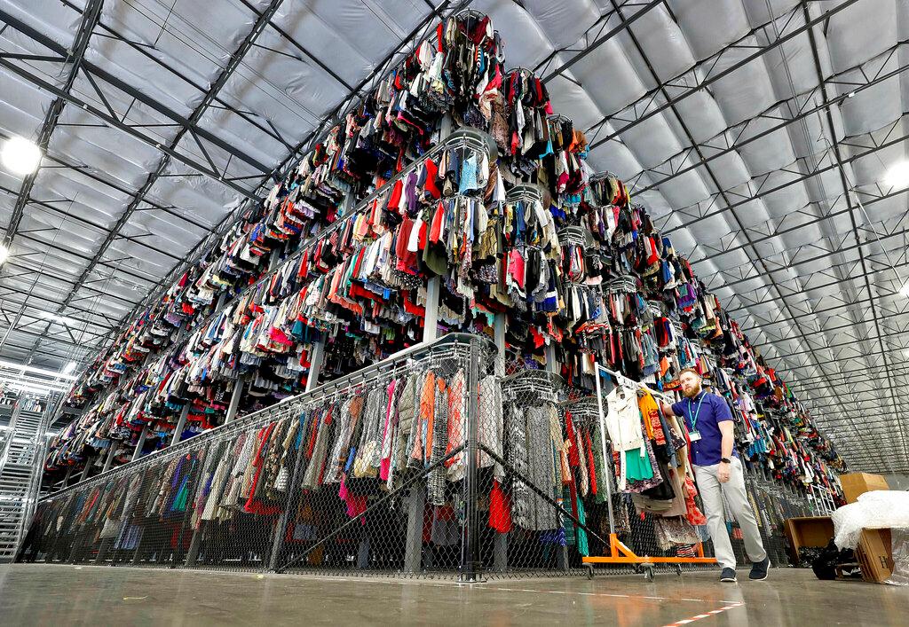 Thousands of garments are stored on a three-tiered conveyor system at the ThredUp sorting facility in Phoenix 