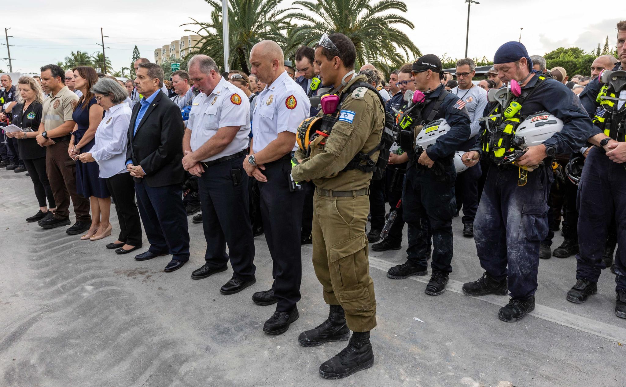 Miami-Dade County officials, members of search and rescue teams and Miami-Dade Fire Rescue