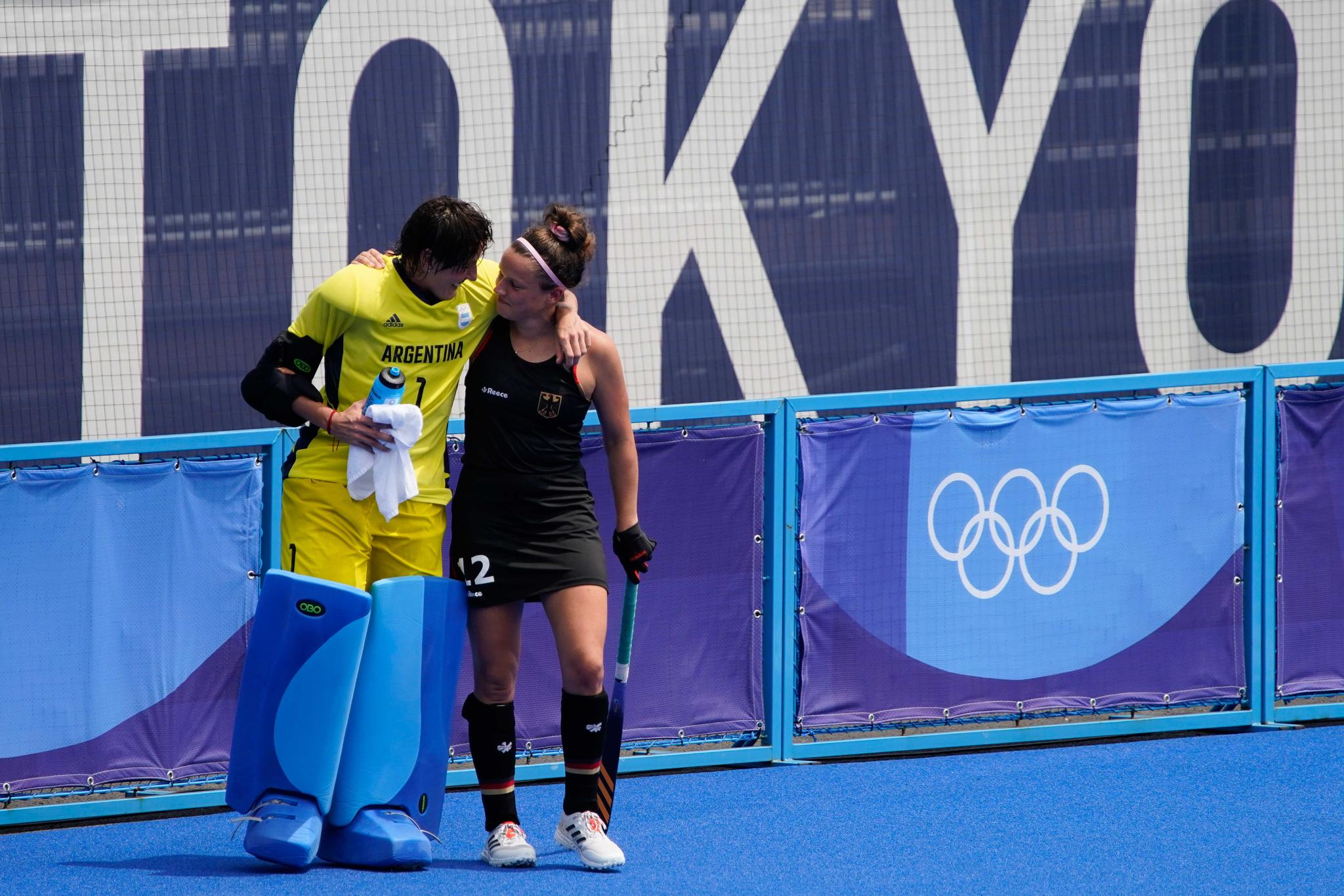Argentina goalkeeper Maria Belen Succi comforts Germany's Charlotte Stapenhorst