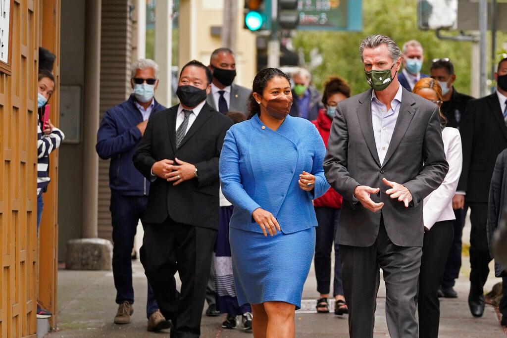 California Gov. Gavin Newsom walks with San Francisco Mayor London Breed on Geary Street 