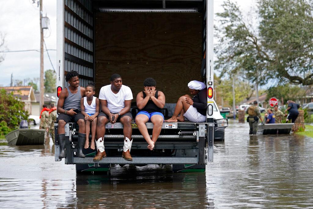 People are evacuated from floodwaters in the aftermath of Hurricane Ida in LaPlace, La.