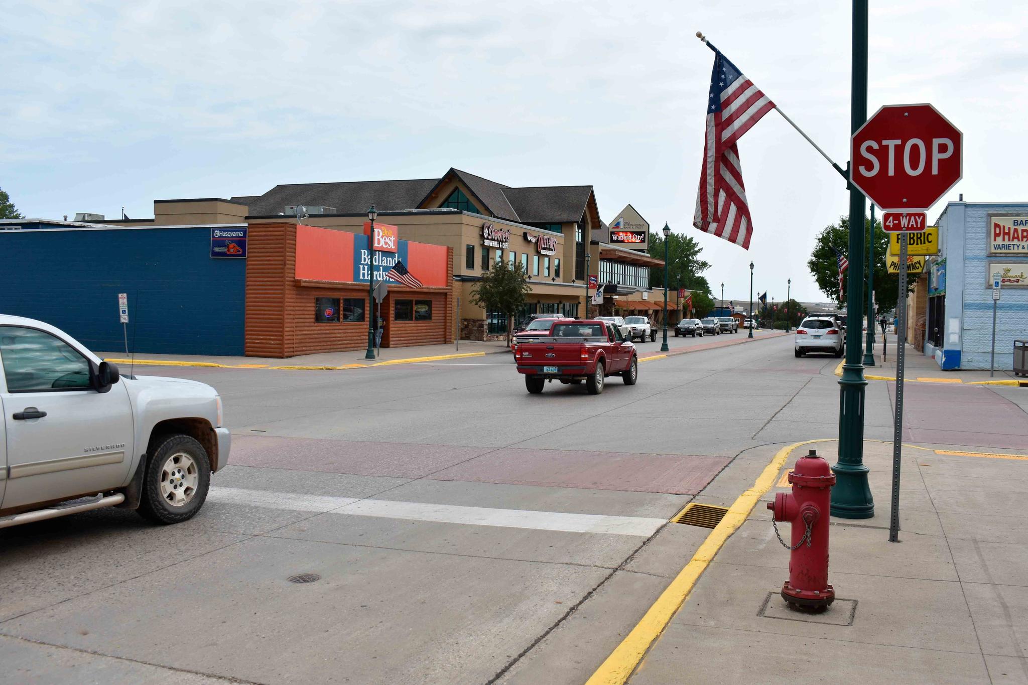 Cars move down Main Street in Watford City, N.D., Aug. 25, 2021, part of McKenzie County.