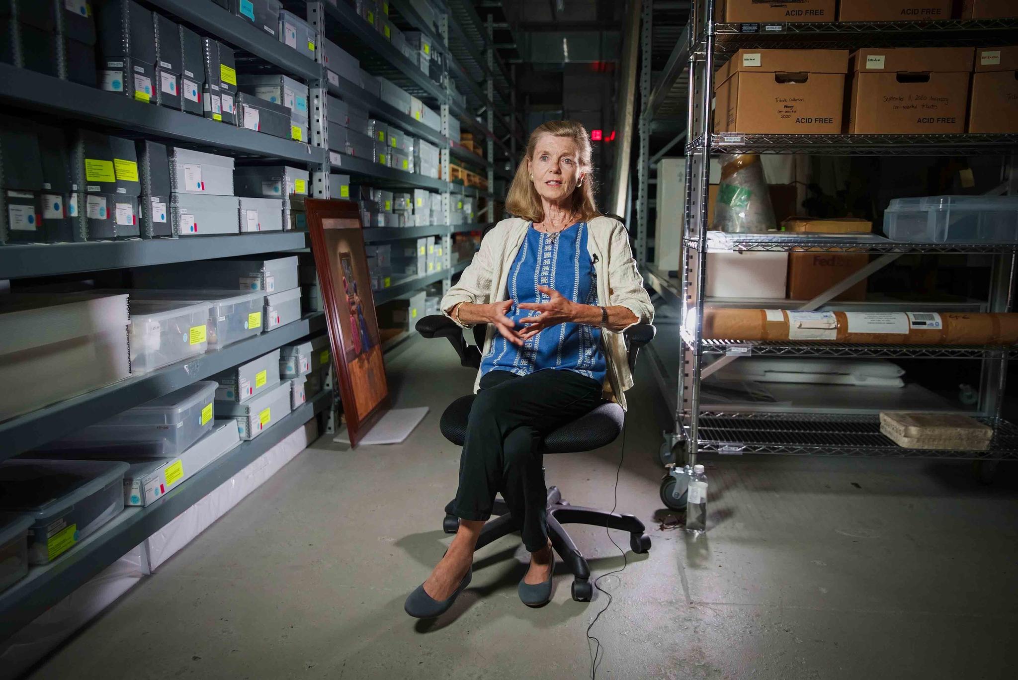 Jan Ramirez, chief curator at the 9/11 Memorial & Museum, sits for an interview inside a warehouse where thousands of artifacts from the 9/11 attacks are archived, July 16, 2021, in Jersey City, N.J.