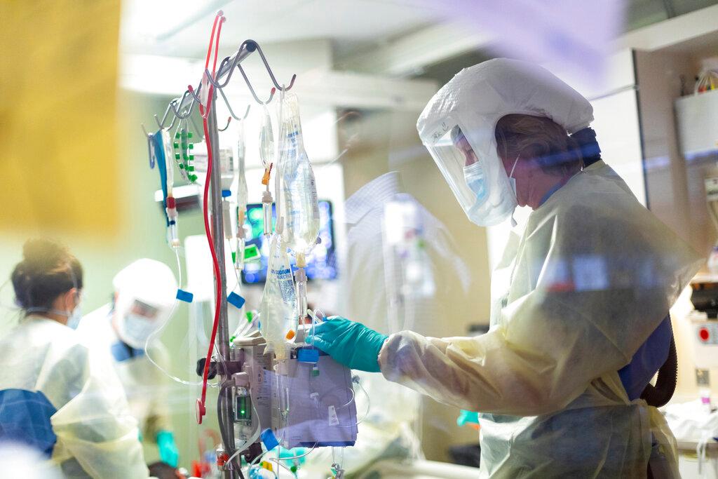 In this Aug. 31, 2021, file photo, Jack Kingsley R.N. attends to a COVID-19 patient in the Medical Intensive care unit (MICU) at St. Luke's Boise Medical Center in Boise, Idaho. Idaho public health leaders have activated "crisis standards of care" for the state's northern hospitals because there are more coronavirus patients than the institutions can handle. The Idaho Department of Health and Welfare made the announcement Tuesday, Sept. 7.