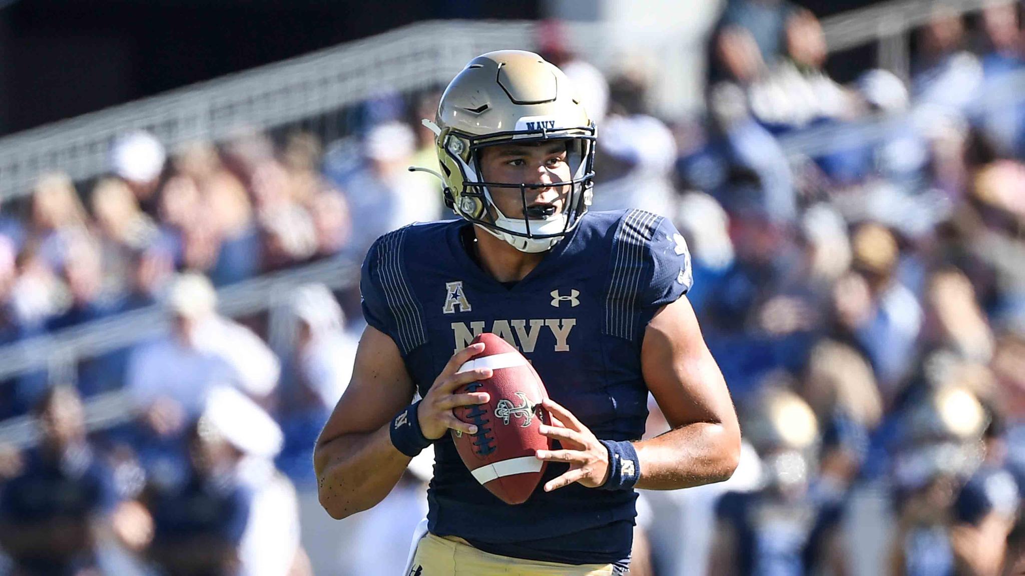 Navy quarterback Tai Lavatai looks to pass the ball during the first half of an NCAA college football game against Marshall, Saturday, Sep. 4, 2021, in Annapolis, Md.