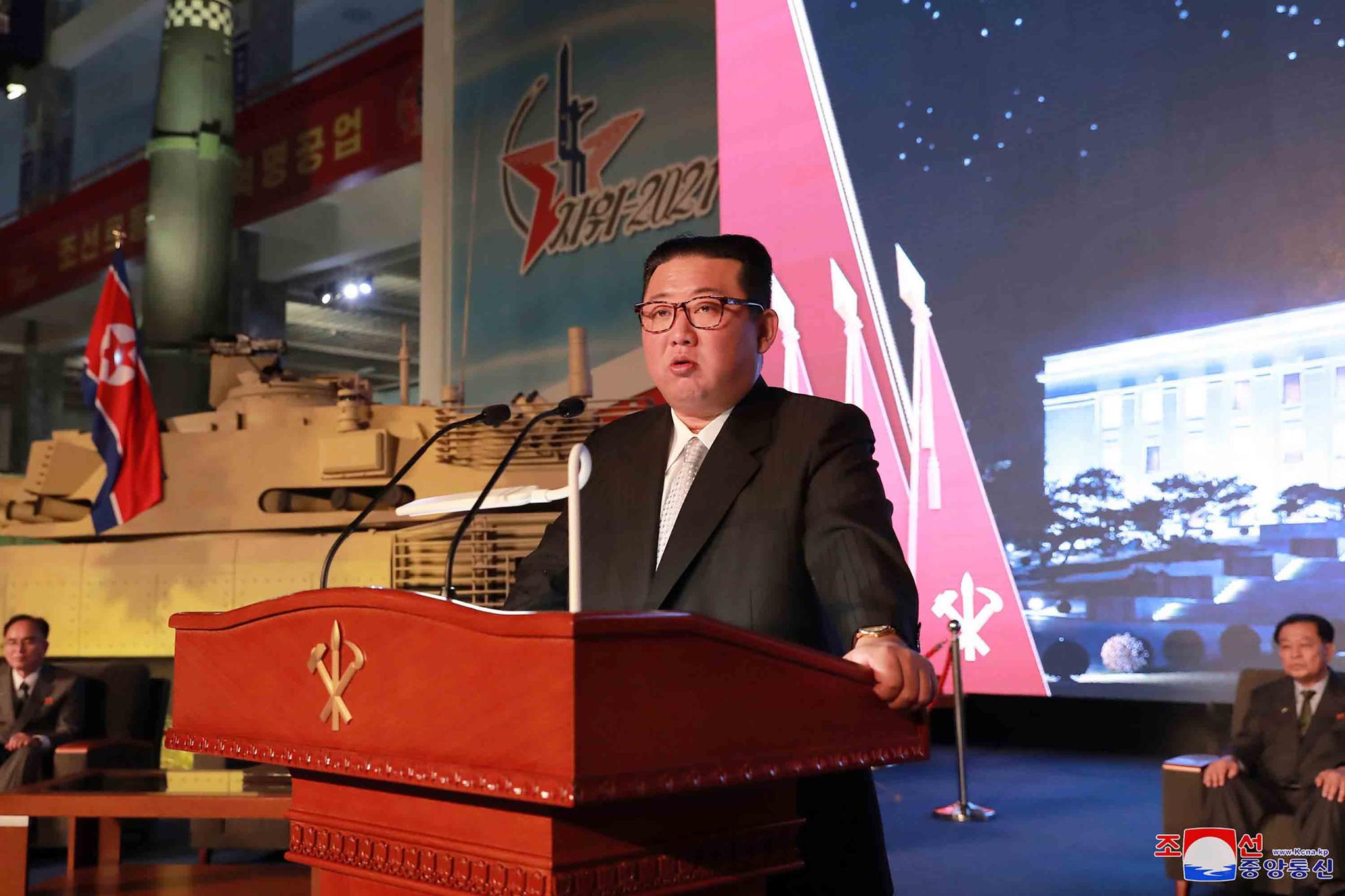 In this photo provided by the North Korean government, North Korean leader Kim Jong Un speaks during an exhibition of weapons systems in Pyongyang, North Korea, Monday, Oct. 11, 2021.