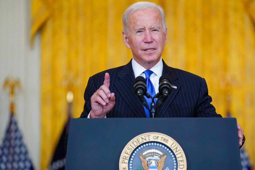 President Joe Biden delivers remarks on efforts to address global supply chain bottlenecks during an event in the East Room of the White House