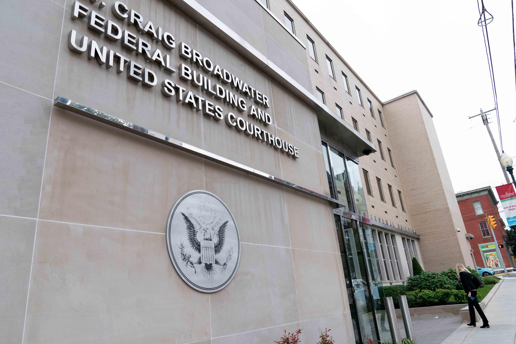 People enter to the U.S. District Courthouse were Jonathan and Diana Toebbe have their hearing in Martinsburg, W.Va., on Tuesday, Oct. 12, 2021.