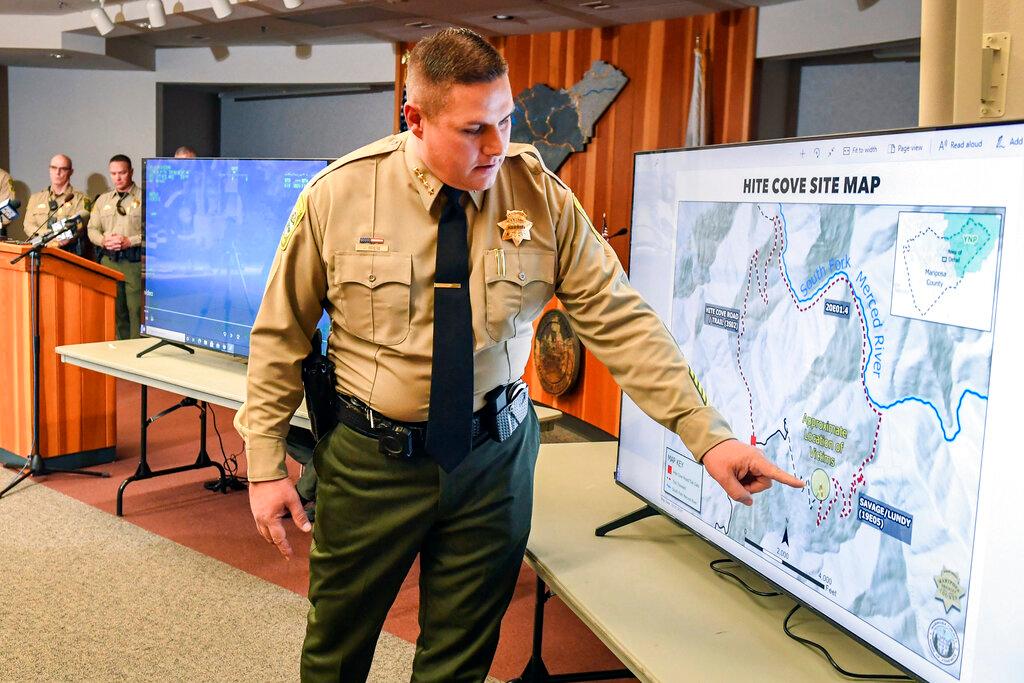 Sheriff Jeremy Briese showing map of hike 