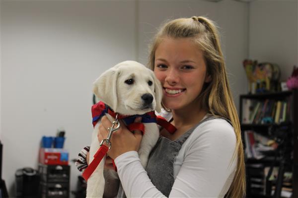 Girl in classroom with dog