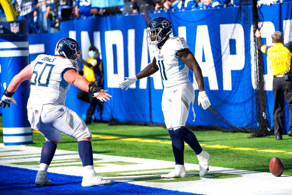 Tennessee Titans wide receiver A.J. Brown (11) celebrates a touchdown with center Ben Jones (60)