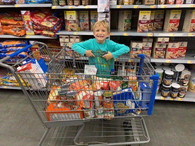 A big smile as Graeme collects provisions for the school can drive, knowing the food will bless others at Thanksgiving 