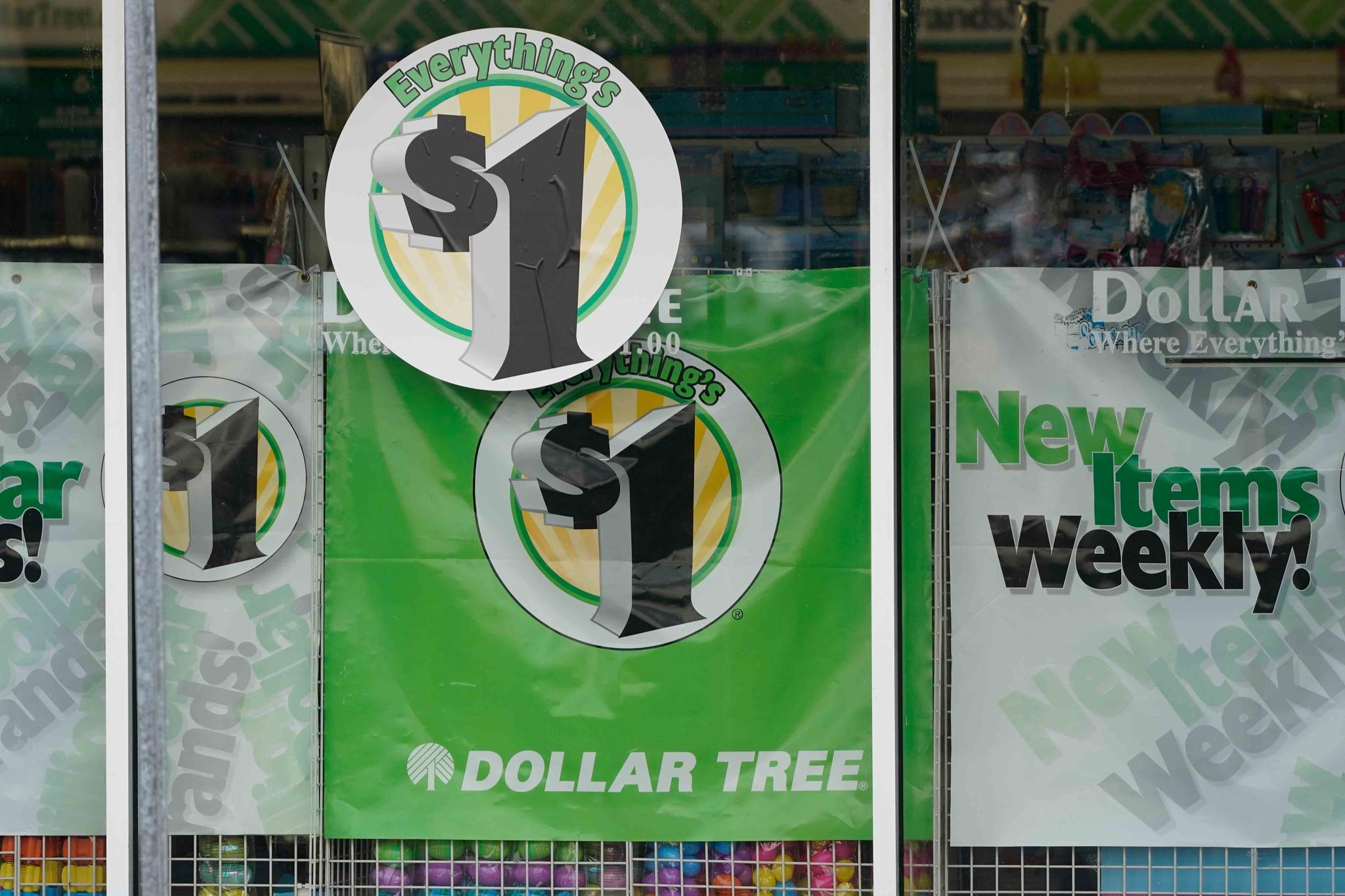 Dollar Tree store logos indicating that everything in the store is for $1 are promoted on a storefront window on Feb. 25, 2021, in Jackson, Miss.