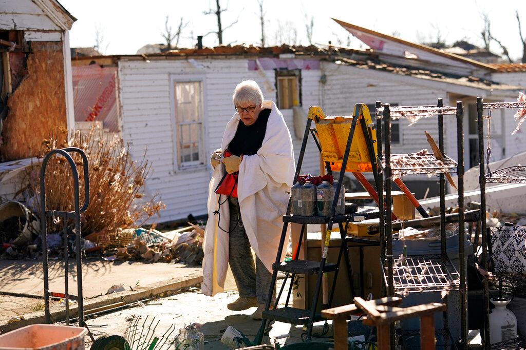 Martha Thomas surveys her destroyed home after the tornadoes in Kentucky 