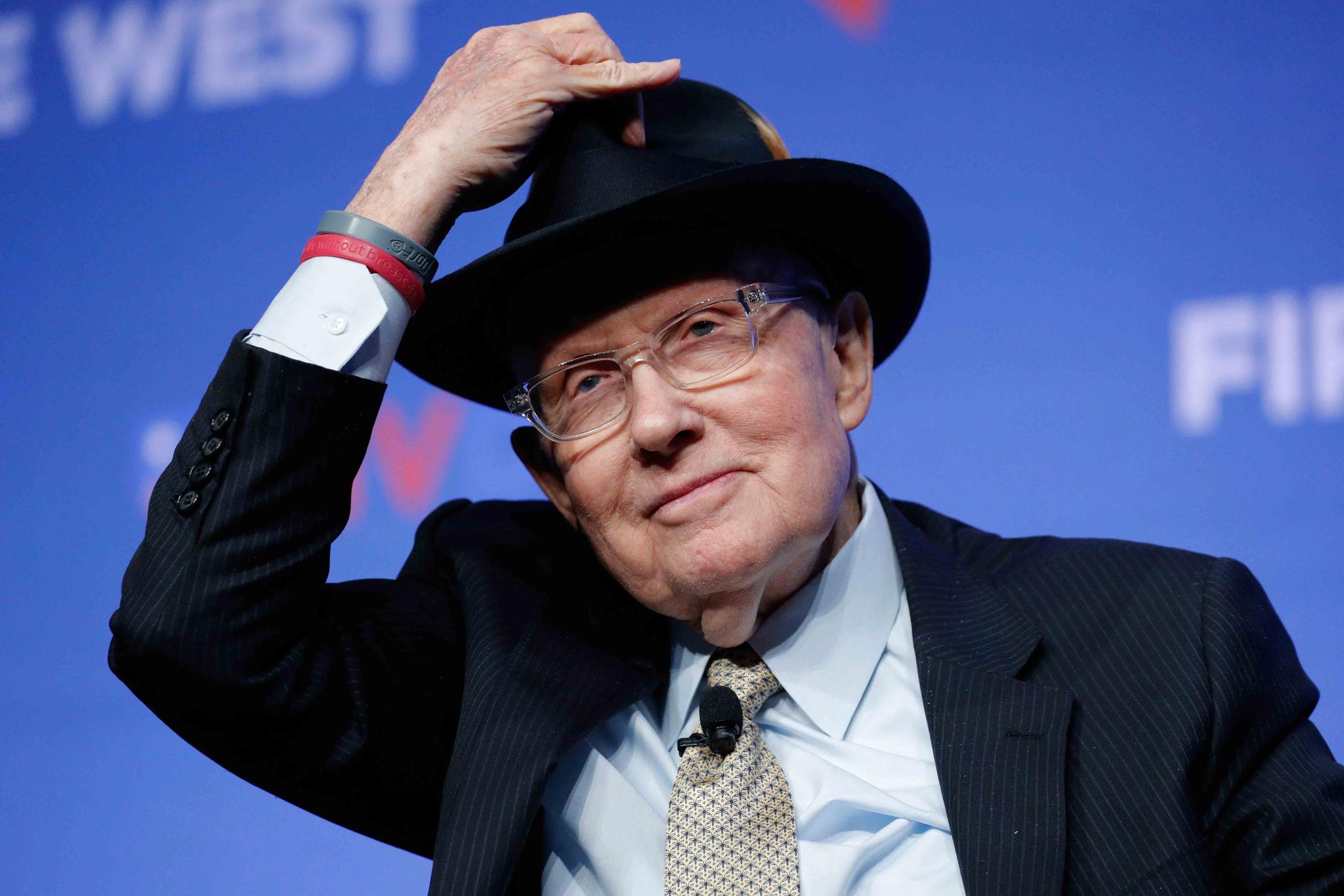 Former U.S. Sen. Harry Reid tips his hat during a fundraiser for the Nevada Democratic Party, on Nov. 17, 2019, in Las Vegas.