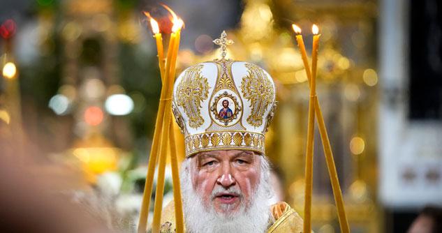 Priest with candles