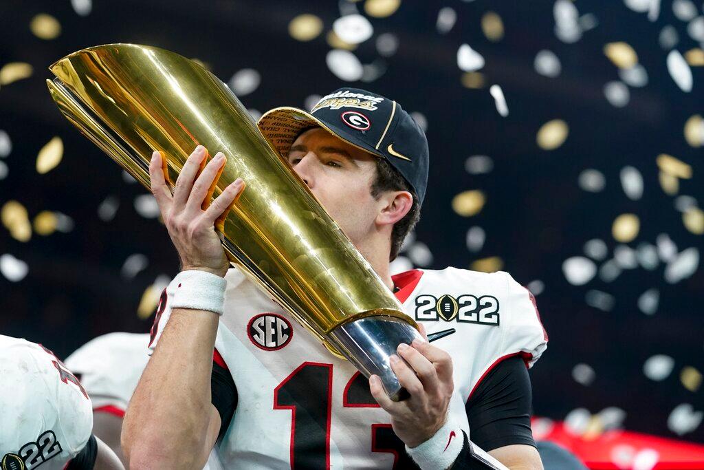 Georgia quarterback Stetson Bennett with CFP trophy 