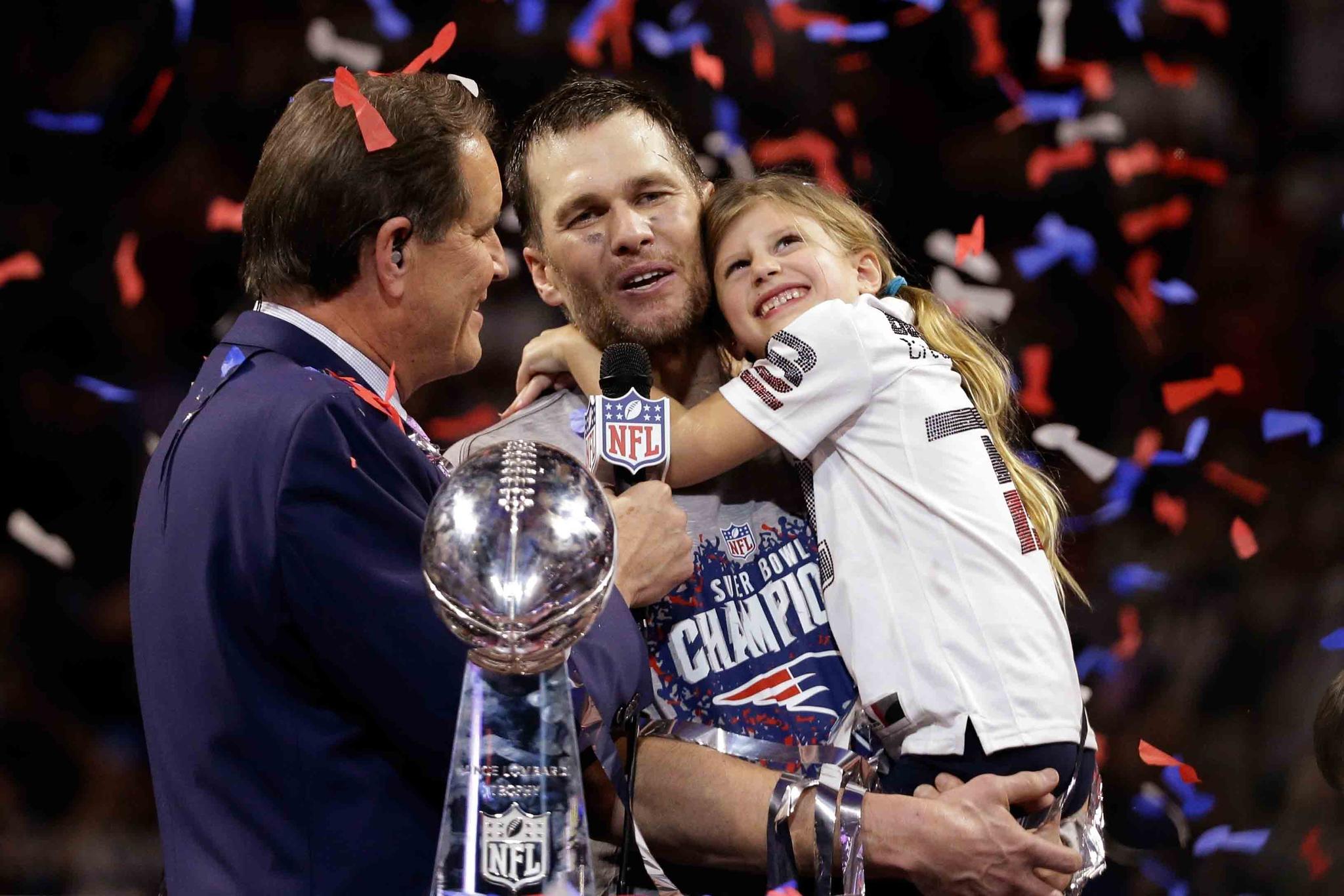 Tom Brady holds his daughter, Vivian, after the NFL Super Bowl 53 football game against the Los Angeles Rams, Sunday, Feb. 3, 2019, in Atlanta.