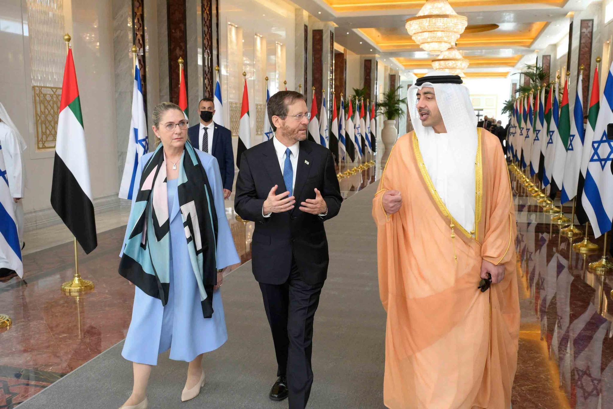 In this photo provided by the Israeli Government Press Office, Israeli President Isaac Herzog, center, and First Lady Michal Herzog are received by UAE Foreign Minister, Sheikh Abdullah bin Zayed Al Nahyan, in Abu Dhabi, United Arab Emirates, Sunday, Jan. 30, 2022.