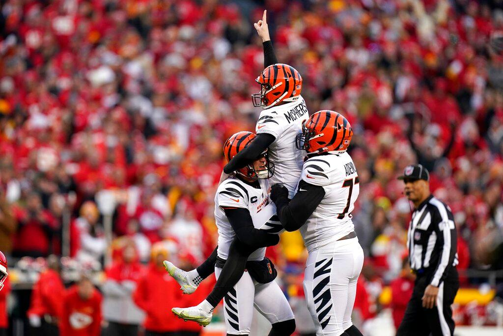 Cincinnati Bengals kicker Evan McPherson (2) celebrates with teammates after kicking a 31-yard field goal during overtime in the AFC championship NFL football game against the Kansas City Chiefs