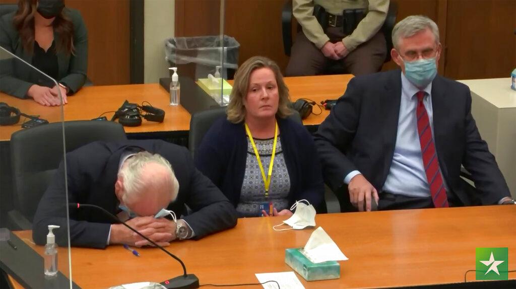 Former Brooklyn Center Police Officer Kim Potter center, with defense attorney Earl Gray, left, and Paul Engh sit at the defense table after the verdict is read 