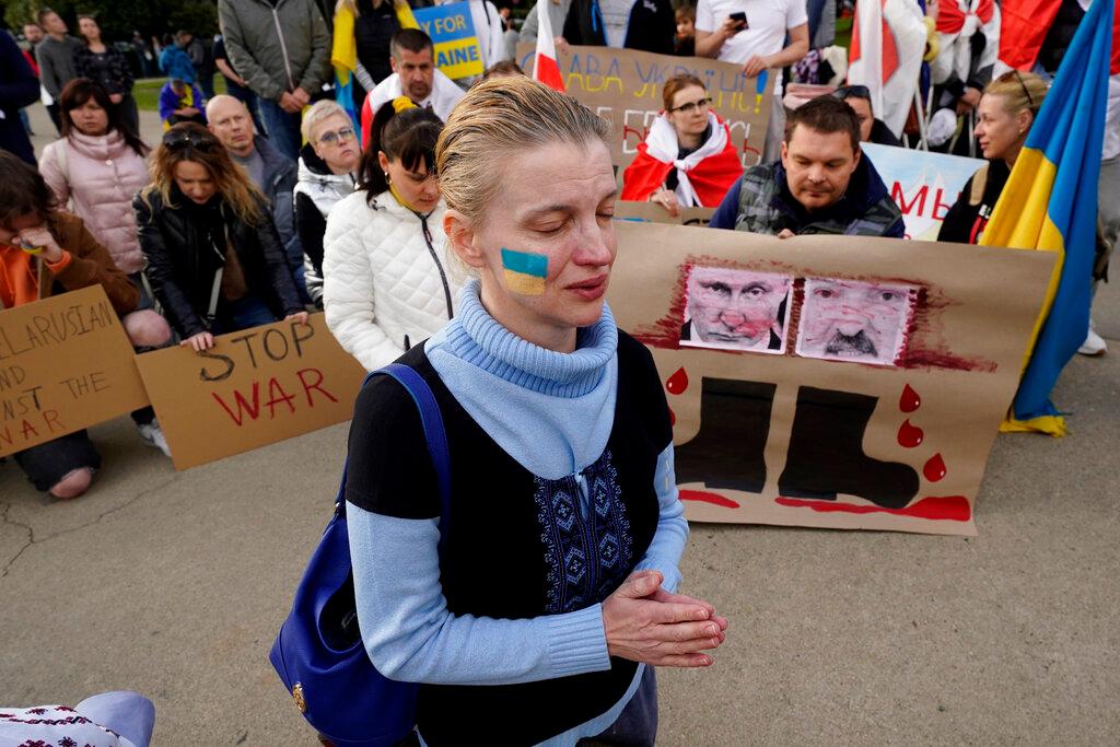 Olena Avtukh praying for Ukraine at rally in Sacramento 