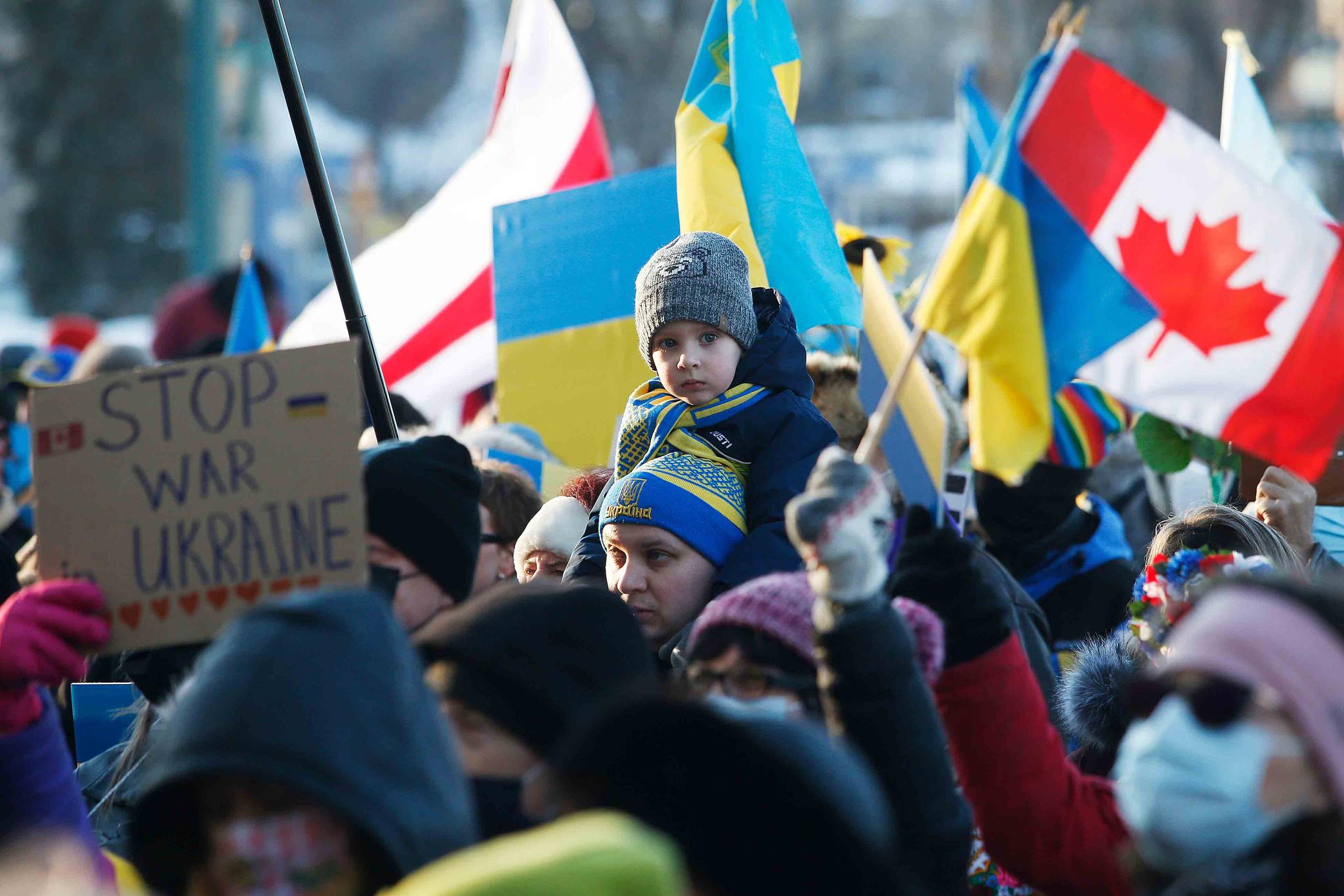 Thousands of people rally in support of the Ukraine outside the Manitoba Legislature in Winnipeg, Manitoba, Saturday, Feb. 26, 2022.