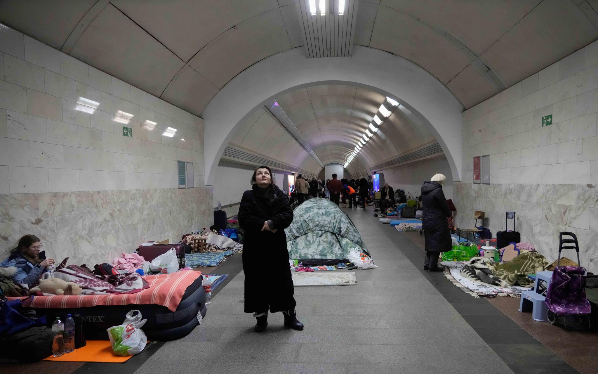 People gather in the Kyiv subway, using it as a bomb shelter in Kyiv, Ukraine, Wednesday, March 2, 2022. Russian forces have escalated their attacks on crowded cities in what Ukraine's leader called a blatant campaign of terror.