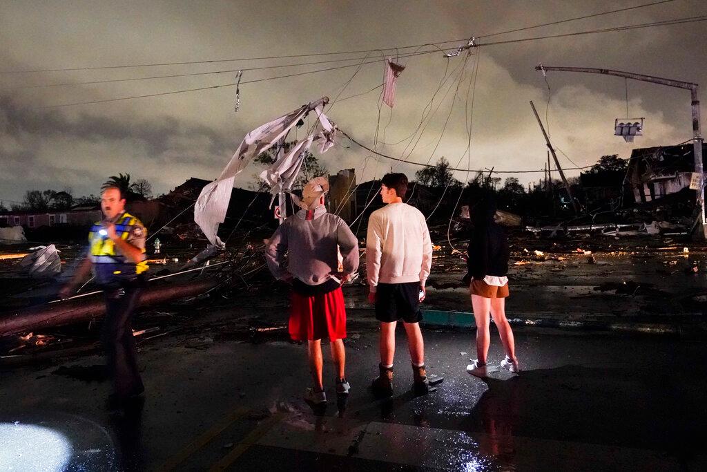 Authorities survey damage in the Lower 9th Ward in New Orleans
