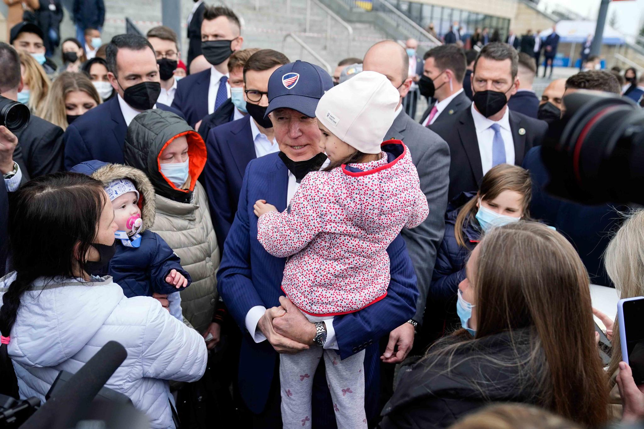 President Joe Biden meets with Ukrainian refugees and humanitarian aid workers during a visit to PGE Narodowy Stadium, Saturday, March 26, 2022, in Warsaw.