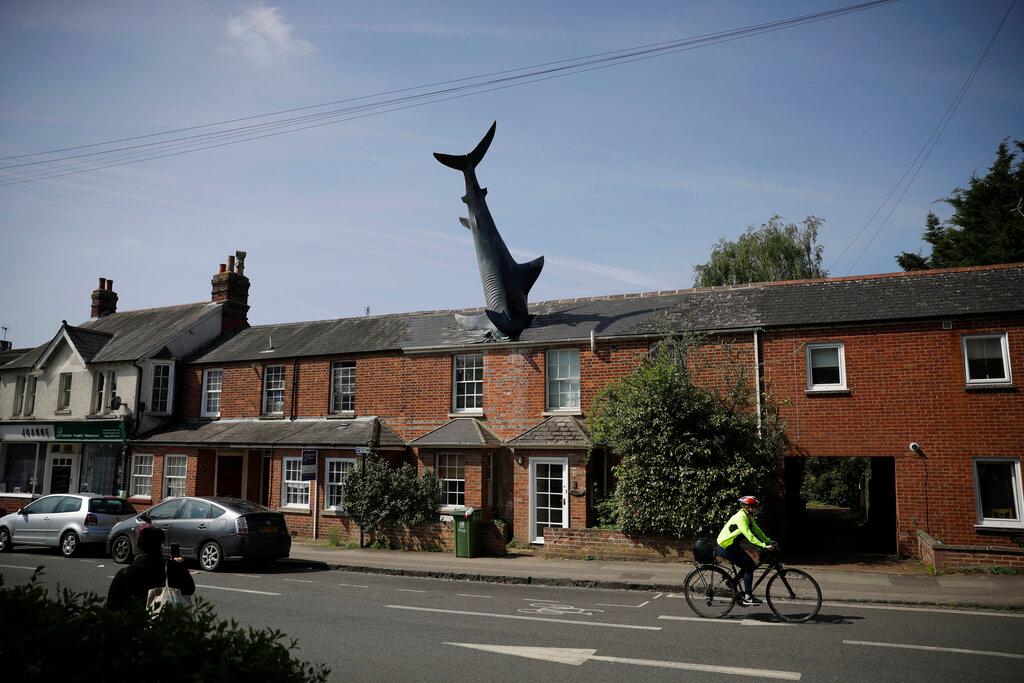  A fibreglass sculpture known as the Headington Shark and originally called "Untitled 1986", by British sculptor John Buckley stands appearing to crash through the roof of a house in the Headington area of Oxford, England