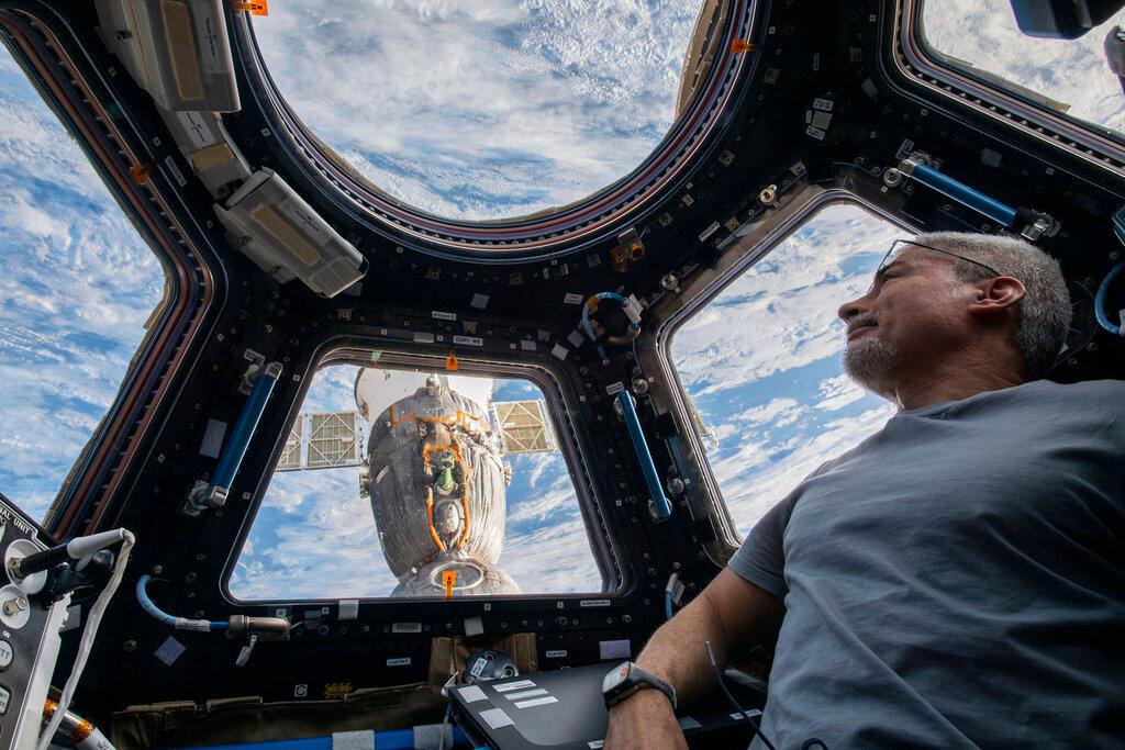 Astronaut Mark Vande Hei at the International Space Station looking down at Earth 