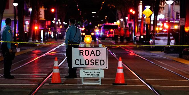 Road closed sign on a dark street