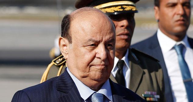 Yemen president bald with men in the background
