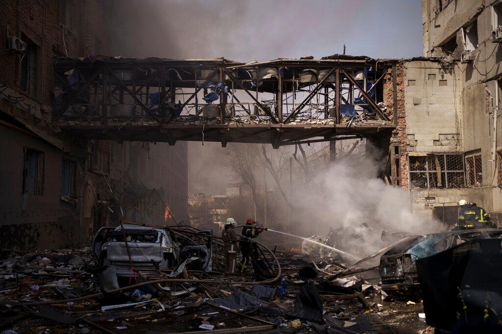 Firefighters work to extinguish multiple fires after a Russian attack in Kharkiv, Ukraine