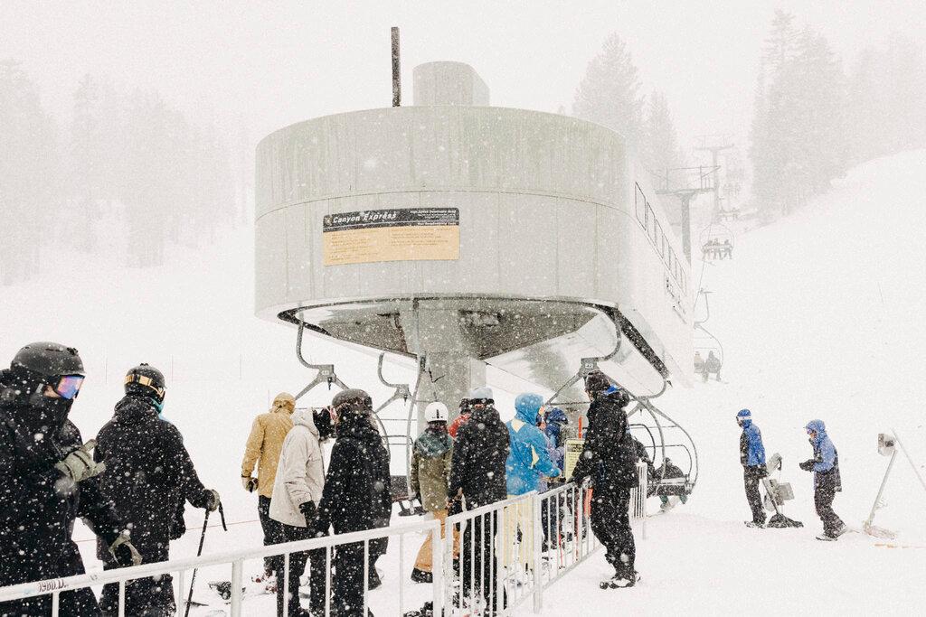Skiers line up at chairlift in Mammoth Mountain in Mammoth Lakes, Calif. 