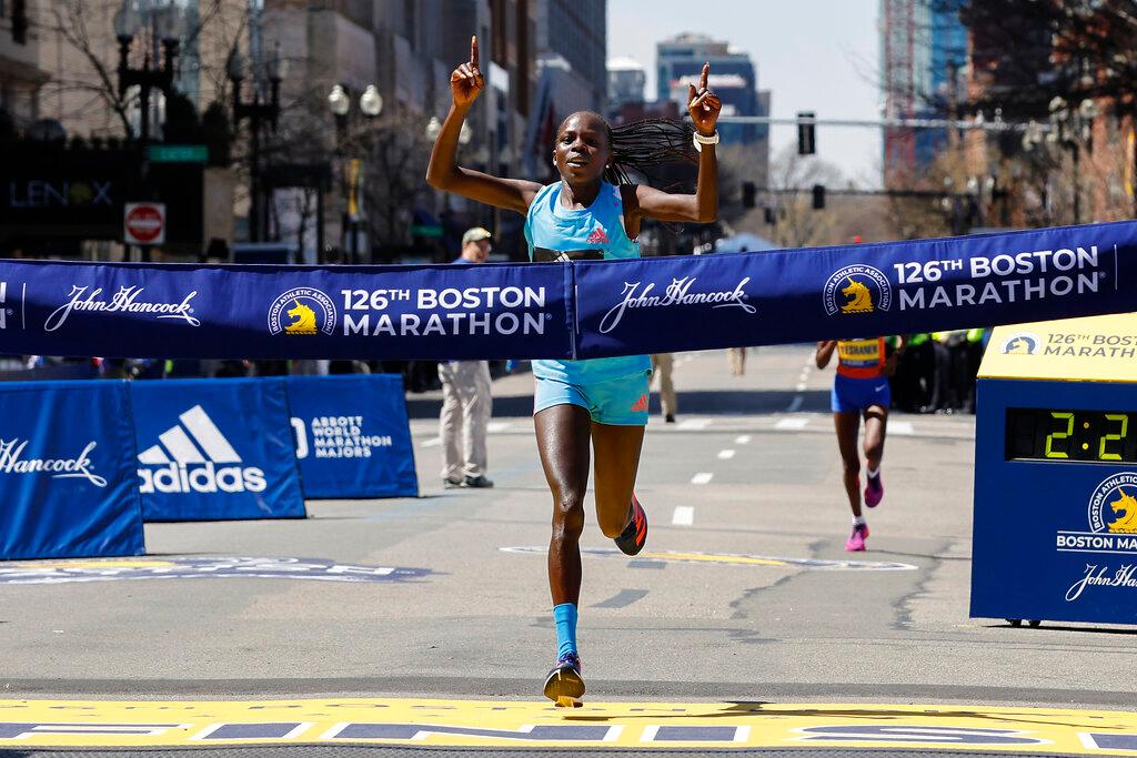 Peres Jepchirchir, of Kenya, crosses the finish line