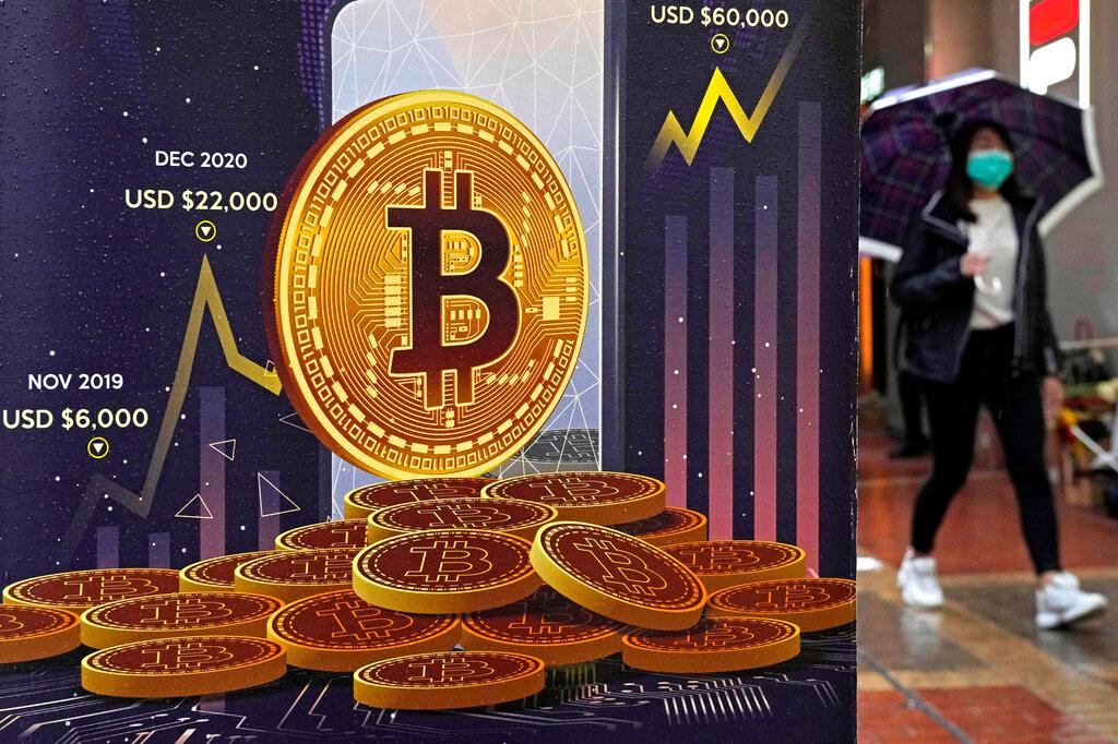 An advertisement for Bitcoin cryptocurrency is displayed on a street in Hong Kong, on Feb. 17, 2022. California on Wednesday, May 4, 2022, became the first state to formally begin examining how to adapt to cryptocurrency and related technologies, following in the path laid out by President Joe Biden in March.