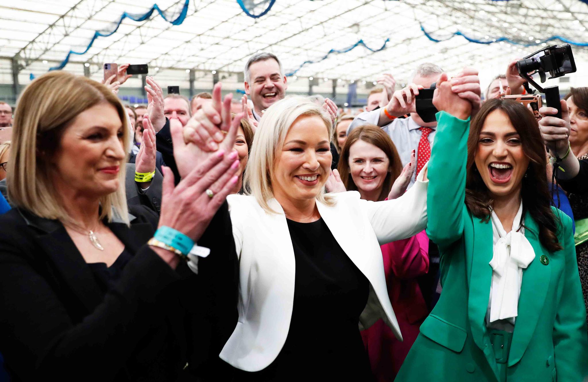 Sinn Fein's Vice President Michelle O'Neill, centre, celebrates with party colleagues after being elected in Mid Ulster at the Medow Bank election count centre in Magherafelt , Northern Ireland, Friday, May, 6, 2022.